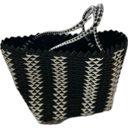 Handmade black and white woven plastic shopping basket